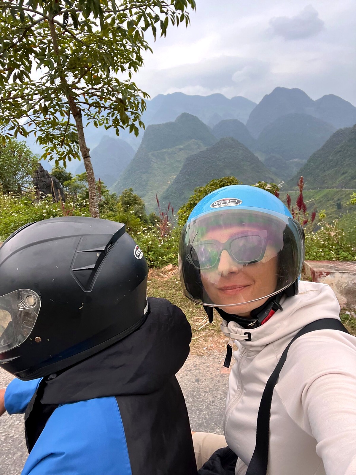 Andreja wearing a helmet on the back of an easy rider’s motorbike