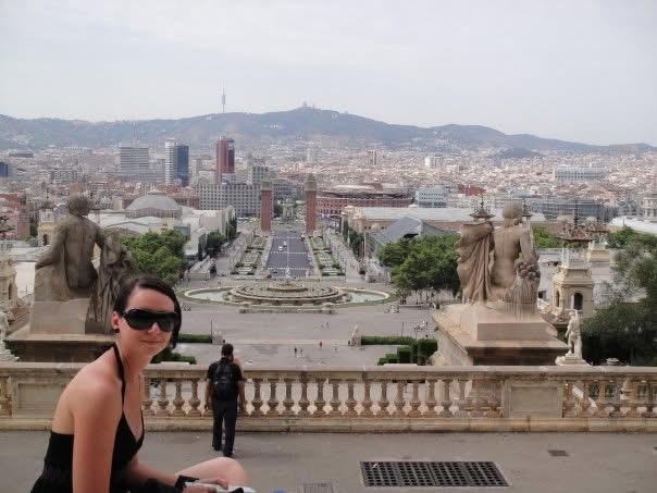 Andreja overlooking Barcelona from Montjuïc, with the city and mountains in the background
