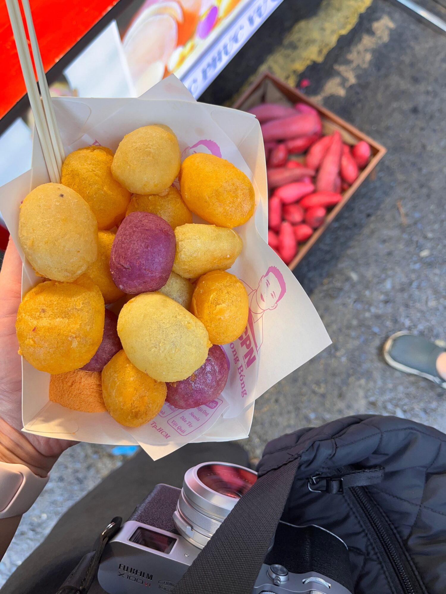 Colourful food tasting served in small round pieces at a Saigon market