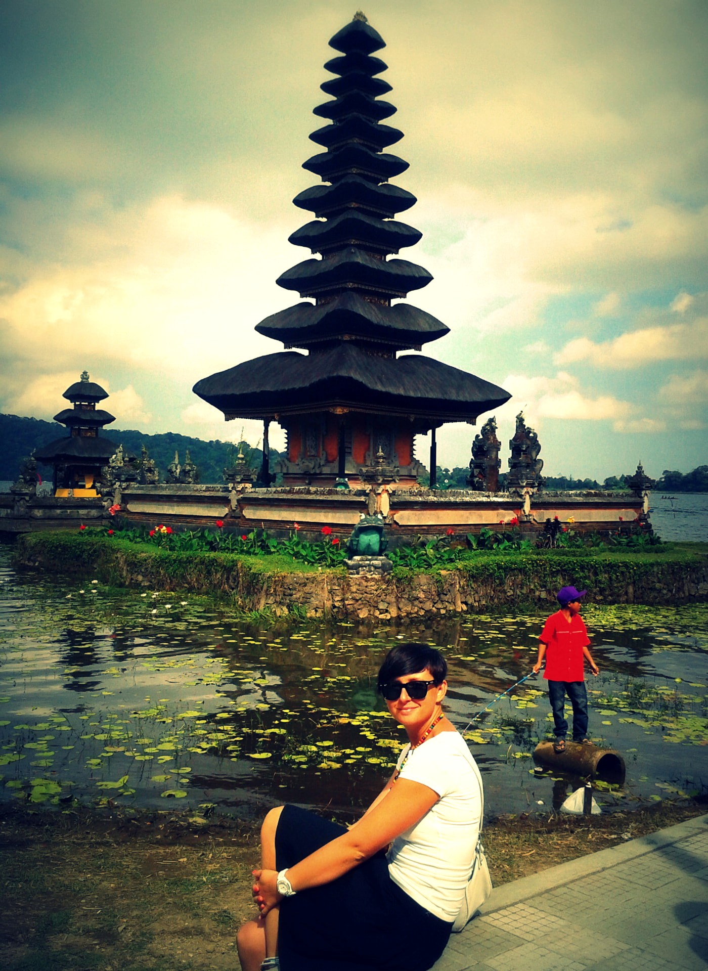 A traveller beside Pura Ulun Danu Bratan on Lake Beratan