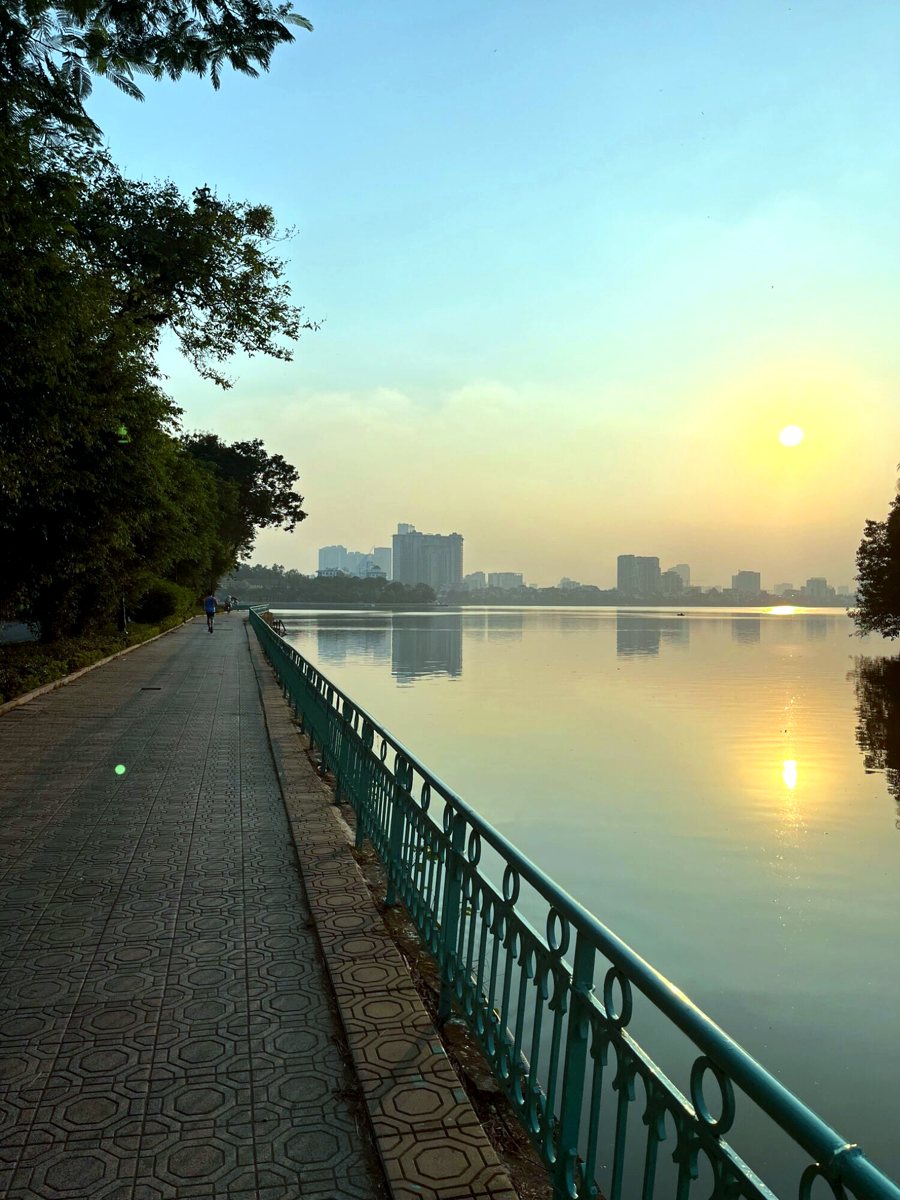 Sunset over West Lake from the lakeside path in Hanoi