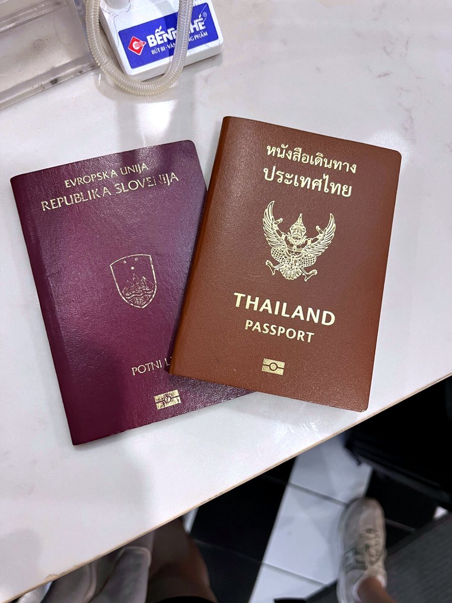 Slovenian and Thai passports side by side