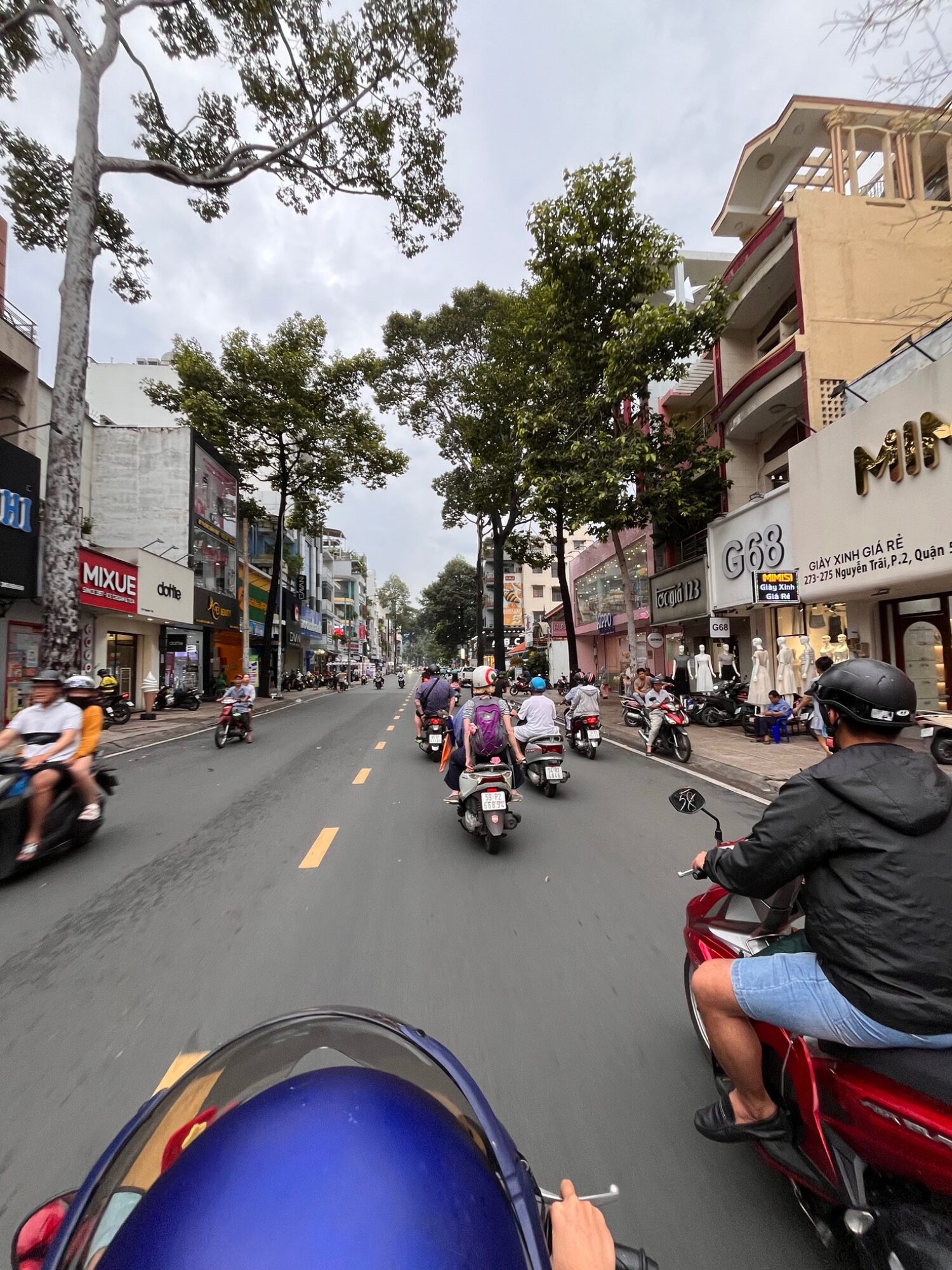 View from the back of a scooter along a Saigon street