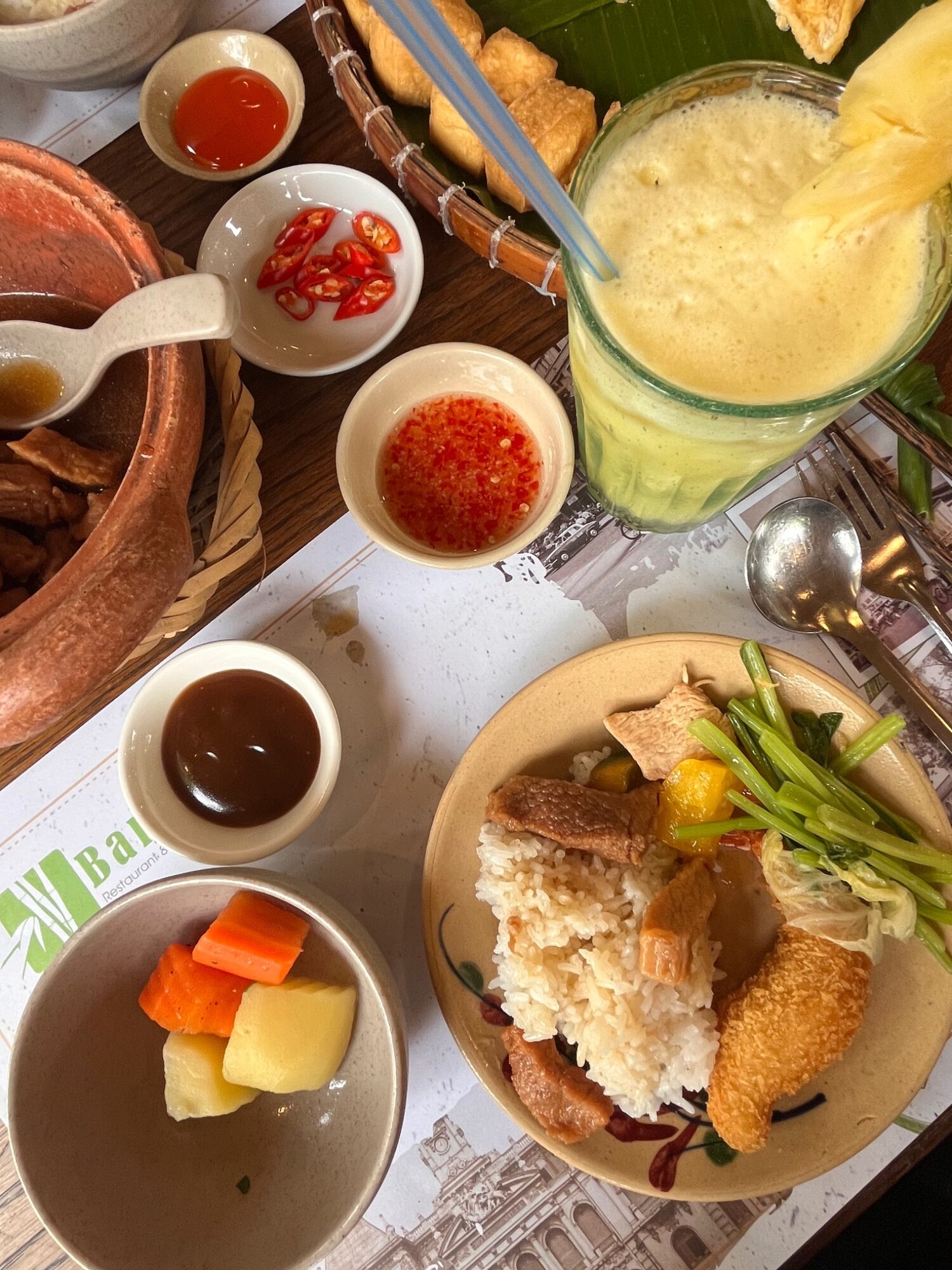 Lunch dishes, dipping sauces and a drink on the Mekong Delta day tour